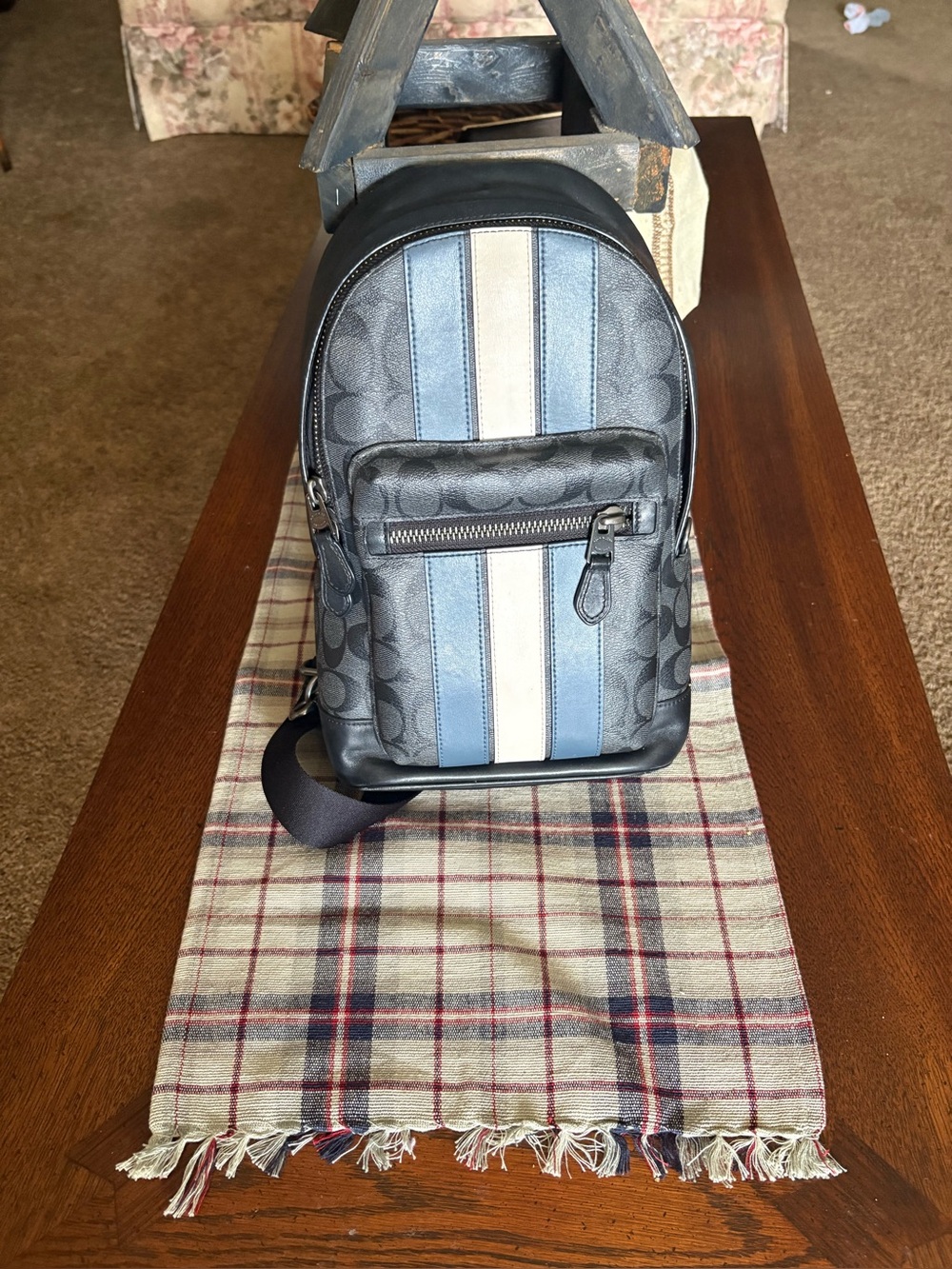 Coach women’s Black with Blue and Cream Stripe Sling Bag